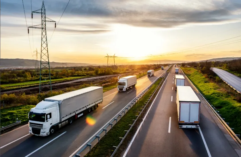 Convoy of freight trucks on the highway
